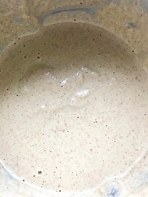 Blended peanuts and spices into smooth mixture